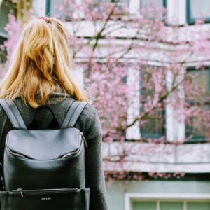 Woman with urban backpack in city
